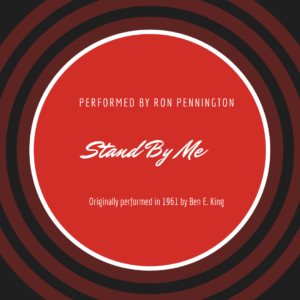 An image of a vintage 45 RPM record with a central label bearing the title "Stand by Me" in bold, elegant letters. Above the title, it reads "Performed by Ron Pennington." The record features a classic black and red color scheme, evoking a nostalgic sense of music history.